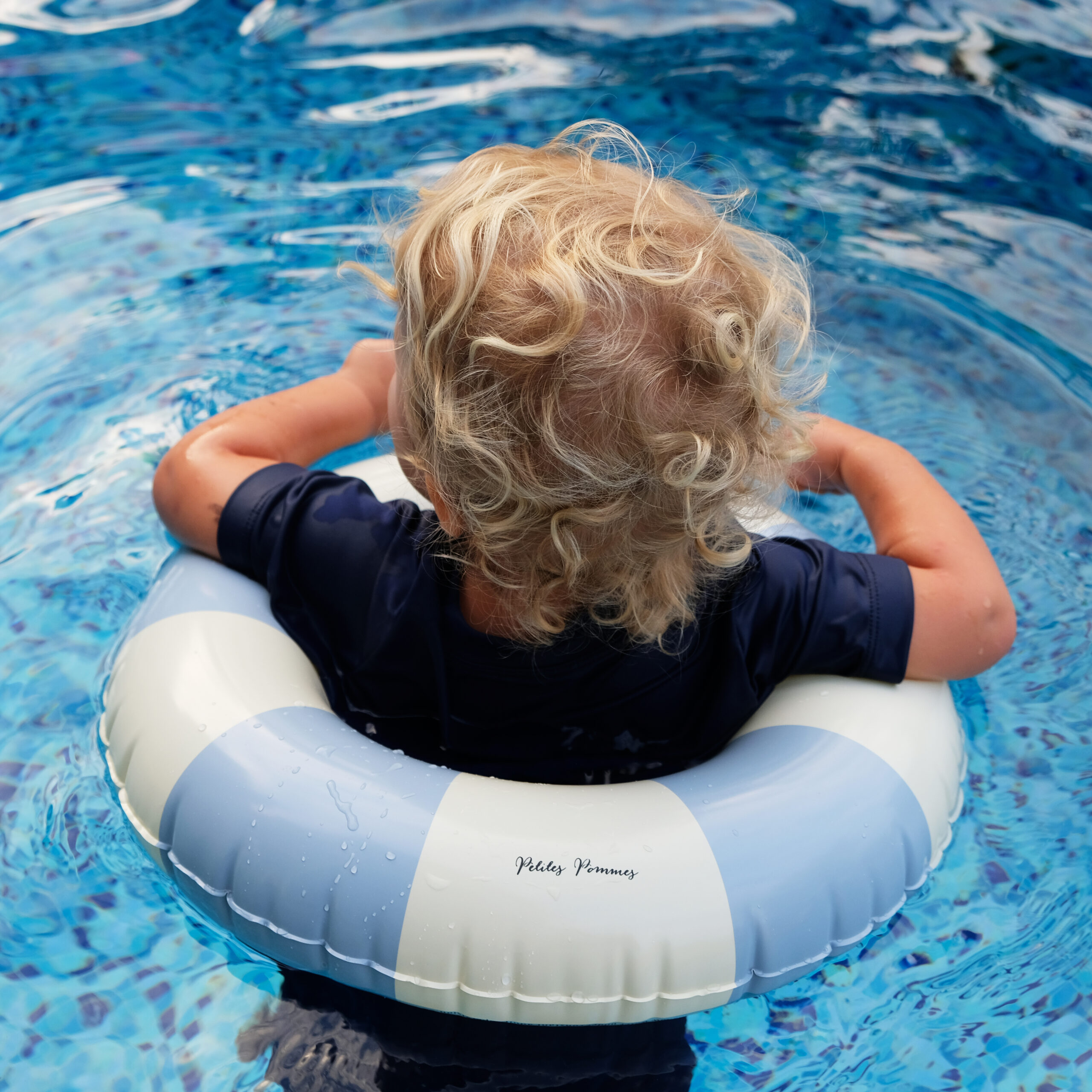 Girl Standing In Inflatable Ring By Swimming Pool Portrait High-Res Stock  Photo - Getty Images