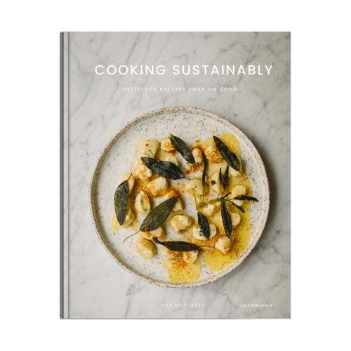 Cozy Publishing Cooking Sustainably Book hardcover book on a white background