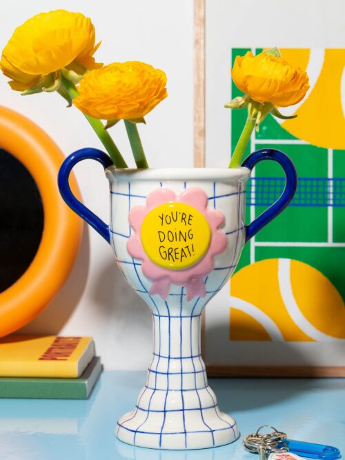 DOIY Trophy Vase You’re Doing Great White with flowers in a colourful interior