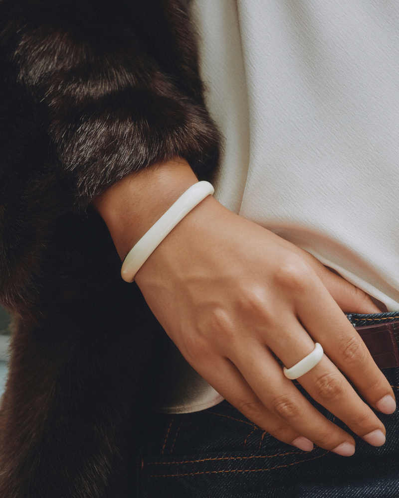 Edblad Lore Bangle Gold/White – worn on the wrist