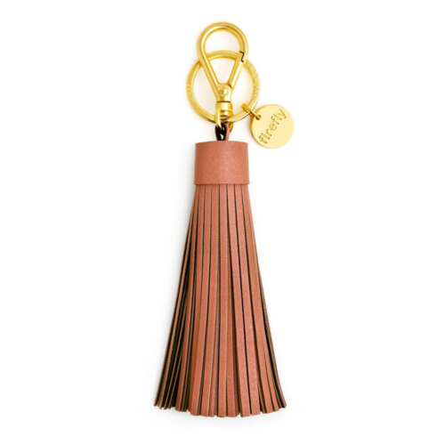 Firefly Soft Tassel oranž, kuldset tooni kinnitus valgel taustal