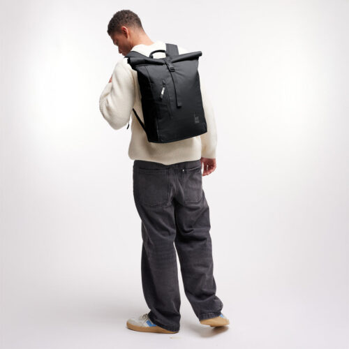 Got Bag Rolltop Easy Monochrome Black worn by a model from the back