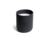 o k o Blackcurrant scented candle in a black vessel