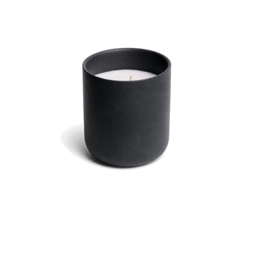 o k o Blackcurrant scented candle in a black vessel