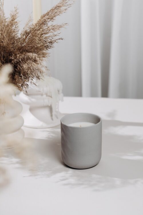o k o Scented Candle Blackcurrant, 220 g in an interior setting