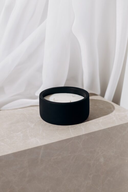 o k o Scented Candle Cinnamon, 220 g in an interior setting