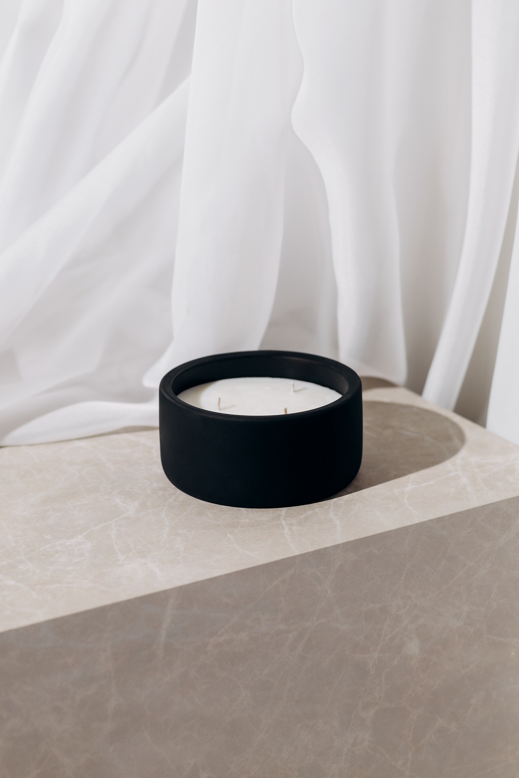 o k o Scented Candle Cinnamon, 220 g in an interior setting