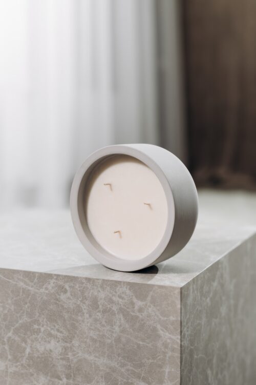 o k o Scented Candle Lemongrass, 220 g in an interior setting