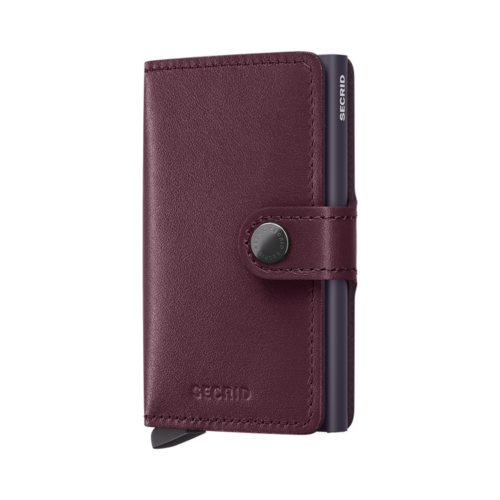 Secrid cranberry-red leather wallet closed on a white background
