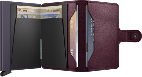 Secrid cranberry-red leather wallet open, showing the interior