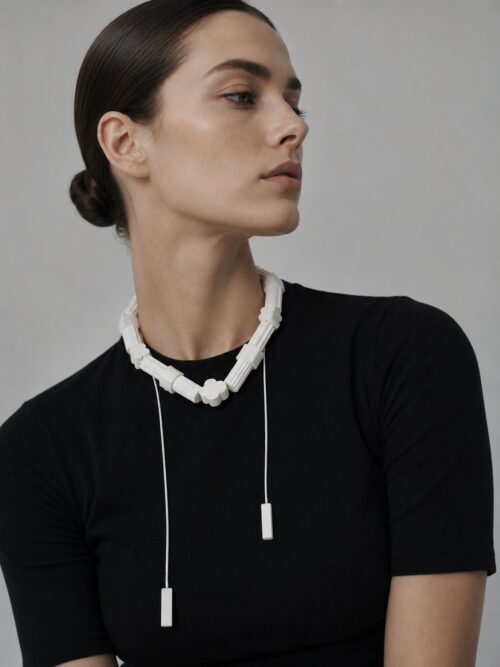 THE AIR Necklace Marshmallow worn as a short necklace with cords at the front