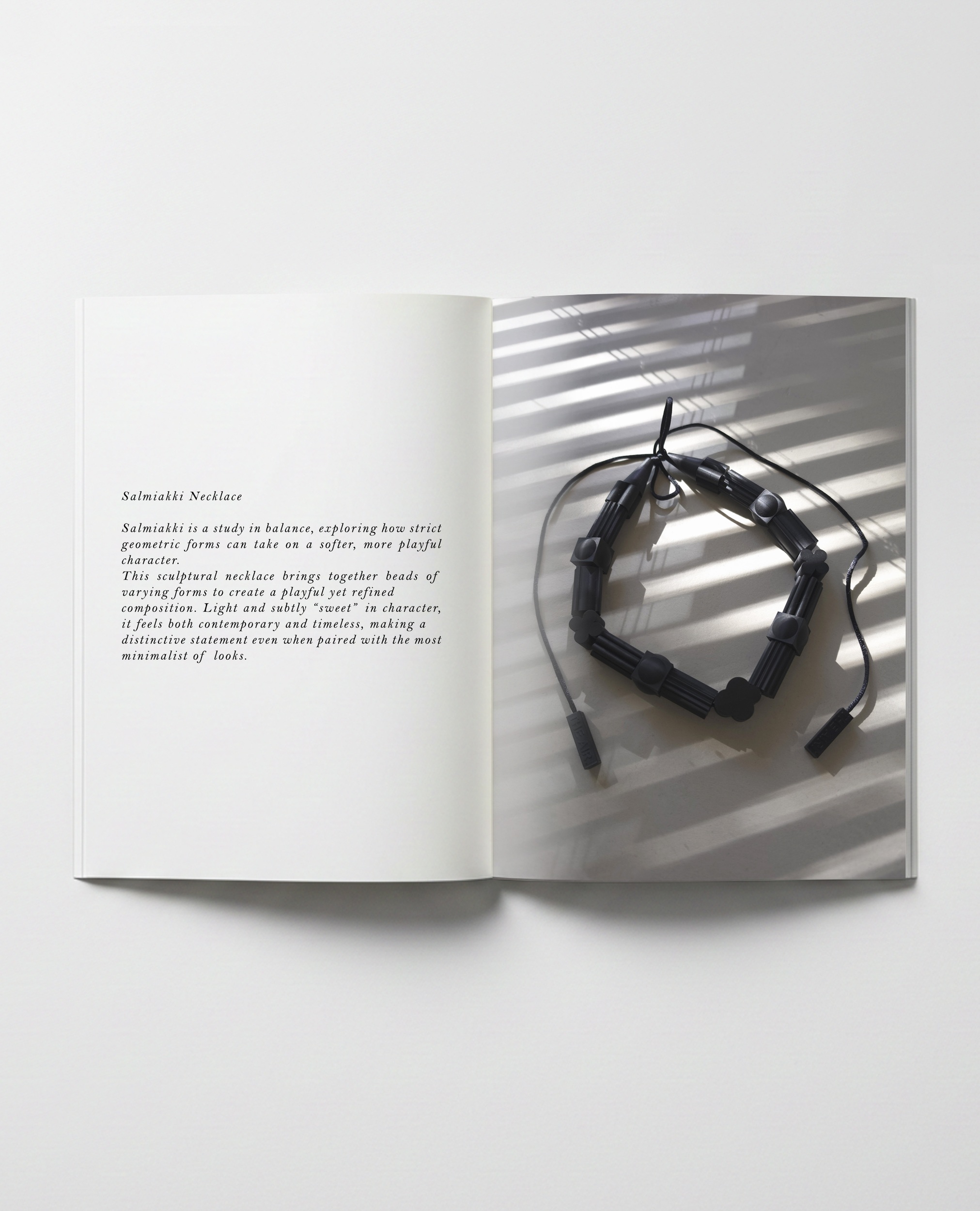 THE AIR Necklace Salmiakki displayed in an open magazine