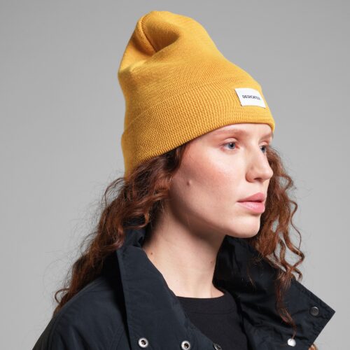 Dedicated Beanie Kiruna Spice Yellow – worn by a model