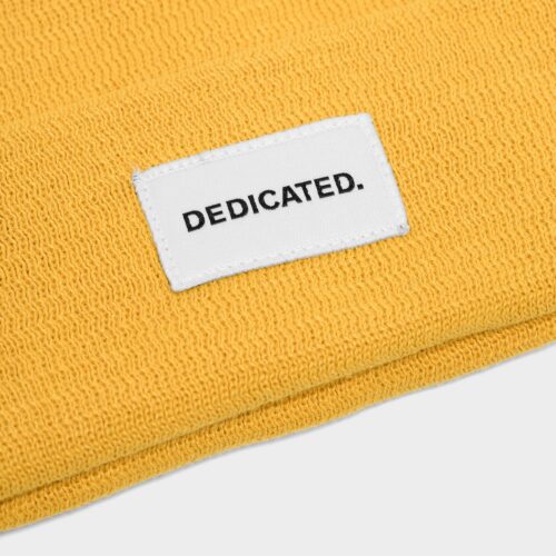 Dedicated Beanie Kiruna Spice Yellow – knit and logo patch detail