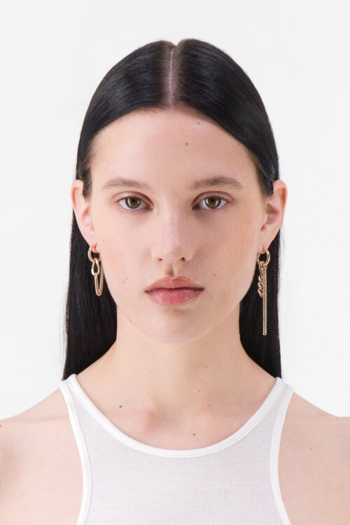 Justine Clenquet Tiko Earrings Gold – earrings worn by a model
